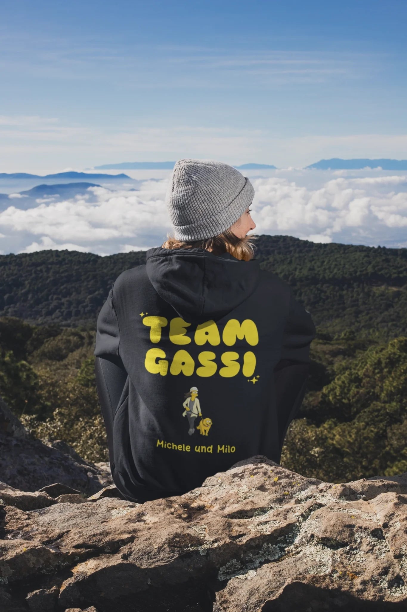 back-view-mockup-of-a-woman-wearing-a-hoodie-while-sitting-in-nature-30491